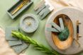 Decorative assortment of eggshell tiles and objects in shades of green