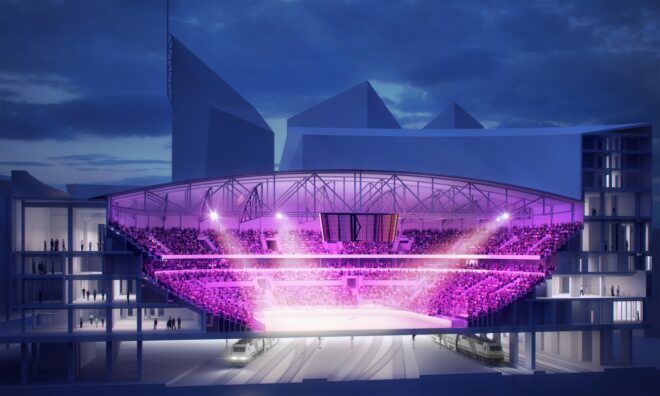 A stadium that is lit up with purple lights