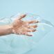 A hand holds a clear film material
