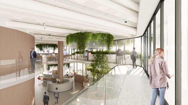 Inside the office building has white hallways and a greenery that hangs from the ceiling