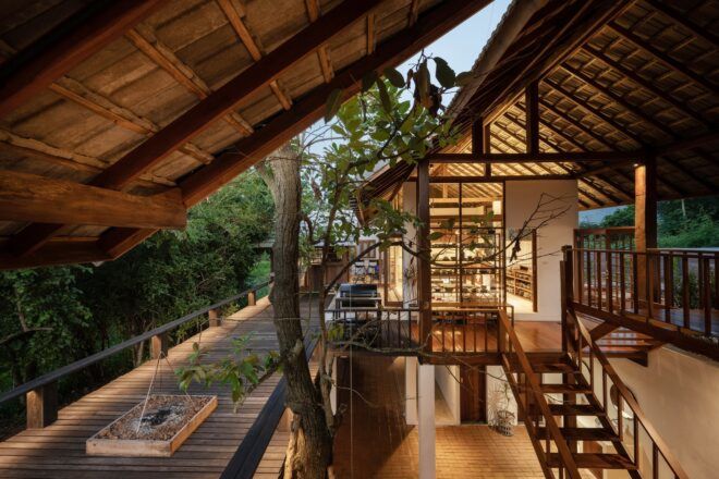 The wooden interior of a house that has open spaces