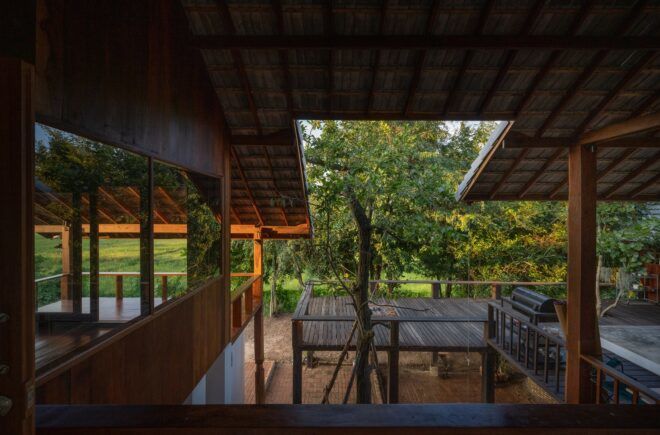 A wood living room that opens up into the scenery outside