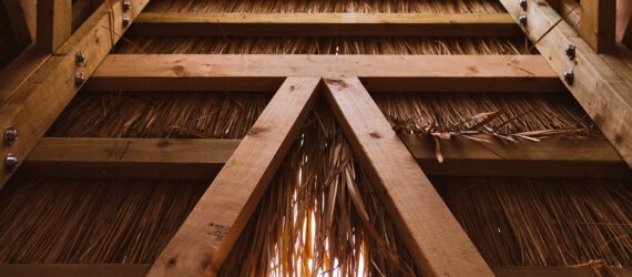 The inside details of the Feelings Library is made out of wood and a hay material