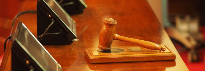 A gavel on a bench.
