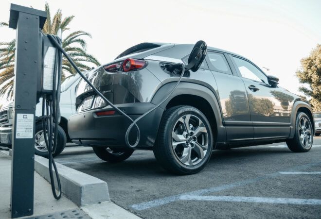 A gray car being charged.