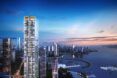 A tall skyscraper in China amidst other skyscrapers sitting beside a river