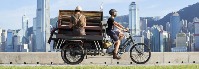 A piano mounted on a bike.