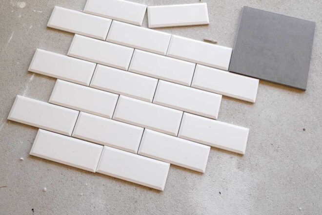 White and grey tile samples that match the tiles used in the project