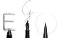 A pencil, a fountain pen and a pen with the writing of letters E, G and O spelled across the three different types of writing utensils