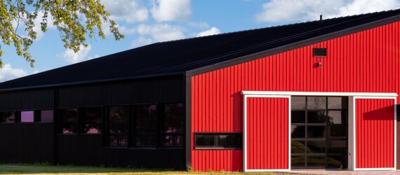 A red barn with a slanted roof