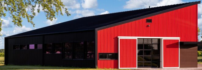 A red barn with a slanted roof