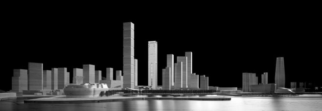 A 3D rendering of the skyline of the skyscrapers sitting against the riverfront
