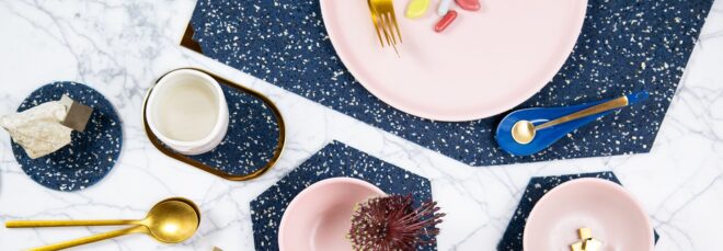 A spread with blue mats and coasters