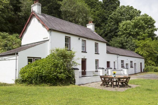 A rustic, white cottage.