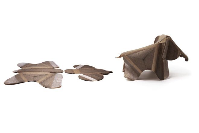 A glad piece of wood and then a fully formed wooden elephant out of the scraps