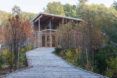 A walkway leading up to a wooden building.