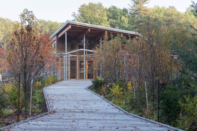 A walkway leading up to a wooden building.