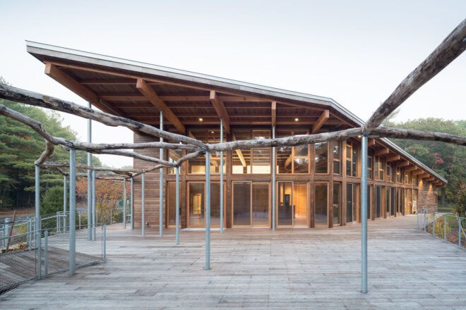A walkway leading up to a wooden building.