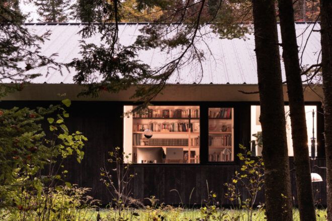 Side view of the house from the forest, looking into one of the studios
