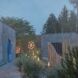 A foggy wellness garden with buildings separately placed and stone pavements