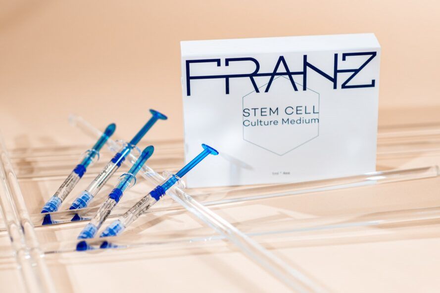 Franz Skincare stem cell serums with a white box packaging next to them