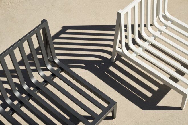 A white metal chair and a black metal chair