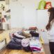 Woman folding and sorting her laundry into piles
