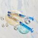 Two serum packaging with blue handles