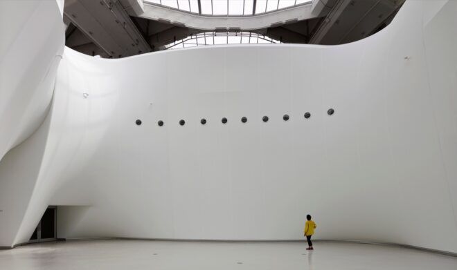 A curved white-walled structure