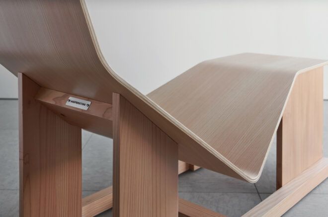 A wooden chaise lounge close up