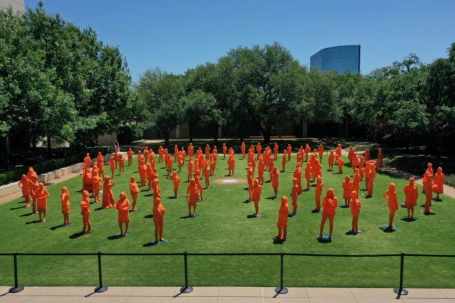 Orange 3D printed sculptures of women trailblazers