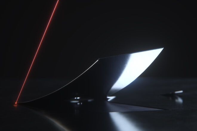 An illustration of metal being folded using industrial origami.