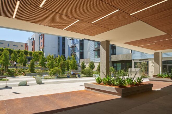 An overhang hallway that opens up into a courtyard