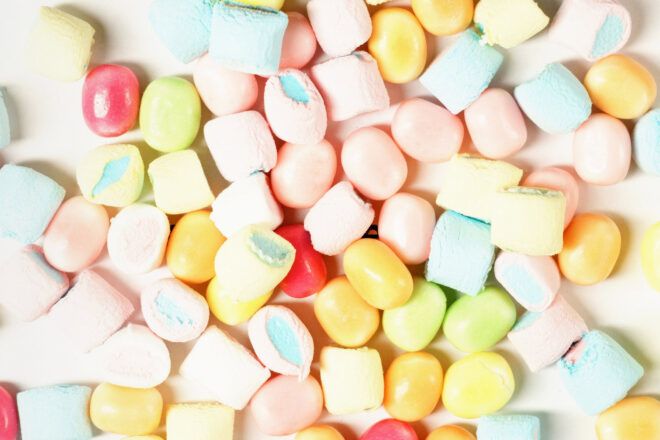 Candy spread out on a white background.
