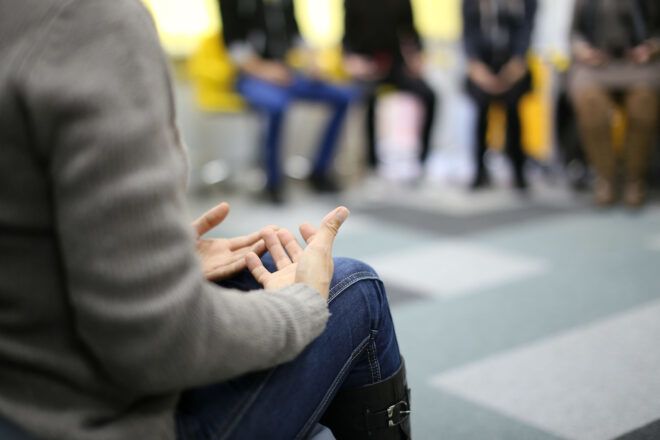 A person in group therapy.