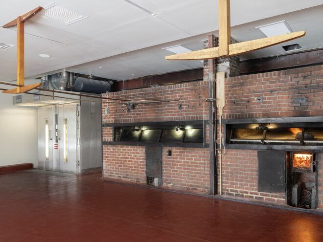 Brick-clad wall for the bread ovens
