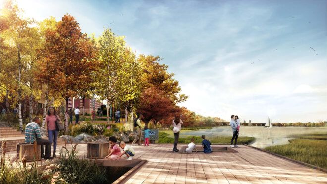 A pier area where people are standing and sitting on the pavement