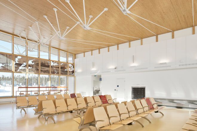 An airport terminal with wood features.