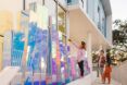 Various heights of rectangle holographic blocks with people looking at it