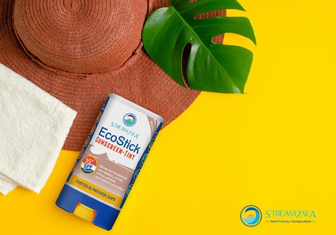 A reef-safe sunscreen against a yellow background.