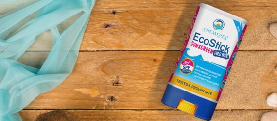 A graphic of a reef-safe sunscreen against a wood background.