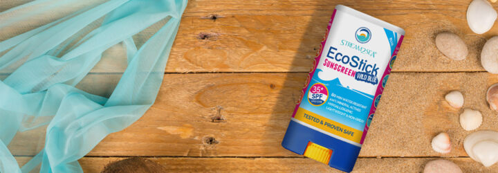 A graphic of a reef-safe sunscreen against a wood background.