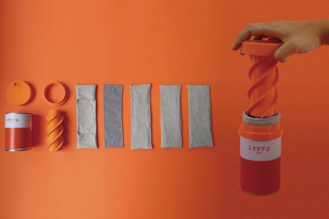 LOOOP reusable menstrual pads can kit opened up on the left, with someone holding the lid of one of the kits on the right side