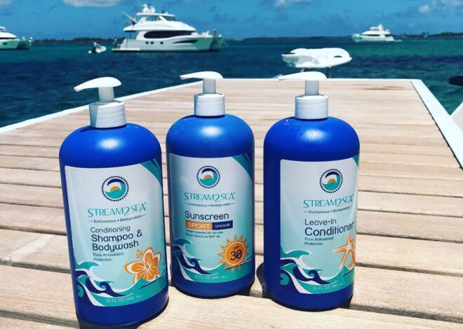 Three bottles of reef-safe sunscreen on a dock.