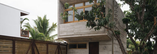 The Casa NU designed by Chris Luce is a two-story narrow house enclosed by a wooden fencing