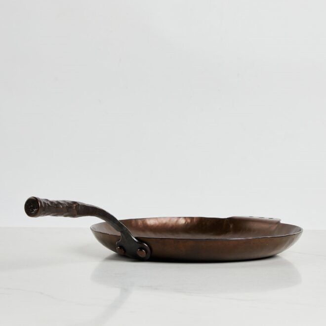 The side of the cast iron pan
