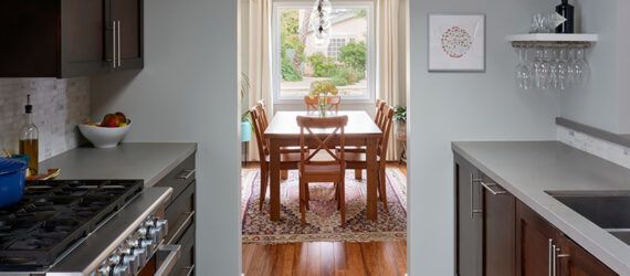 A kitchen with a doorway to the dining room in the middle.