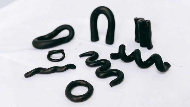Black squiggles laid out on a white background