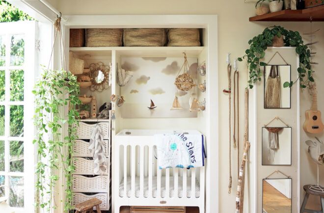 A white crib fits inside a closet space