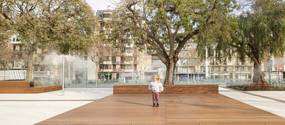 A little child standing on a brick ground area